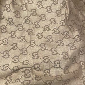 Gucci scarf never worn in mint condition will accept offers as well!